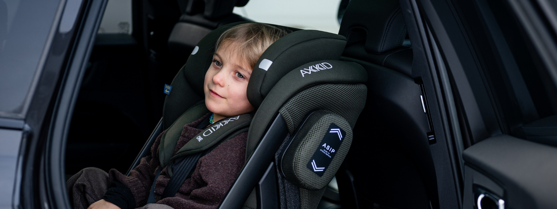 header one 3 fmg boy in rear facing car seat [desktop]