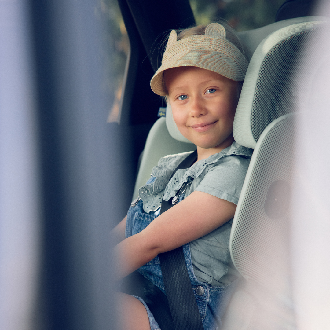 lifestyle axkid up girl sitting in car seat