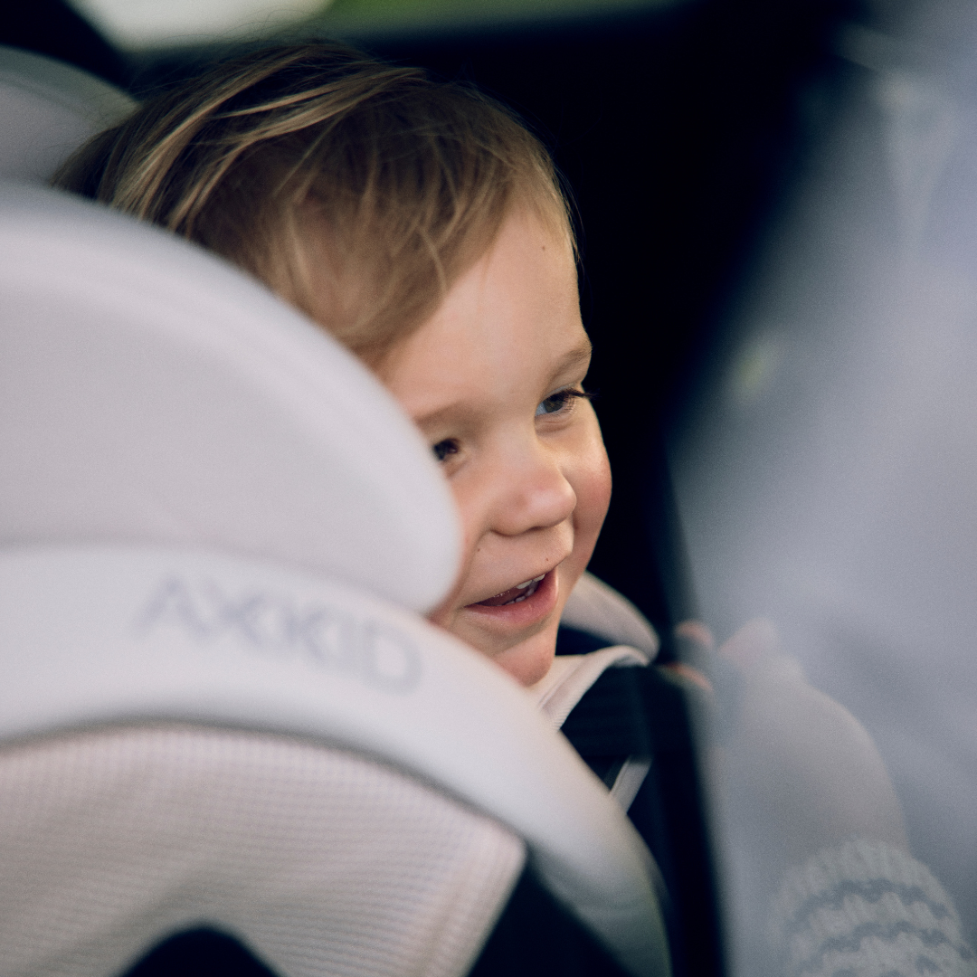 lifestyle one 3 boy in axkid car seat 1x1