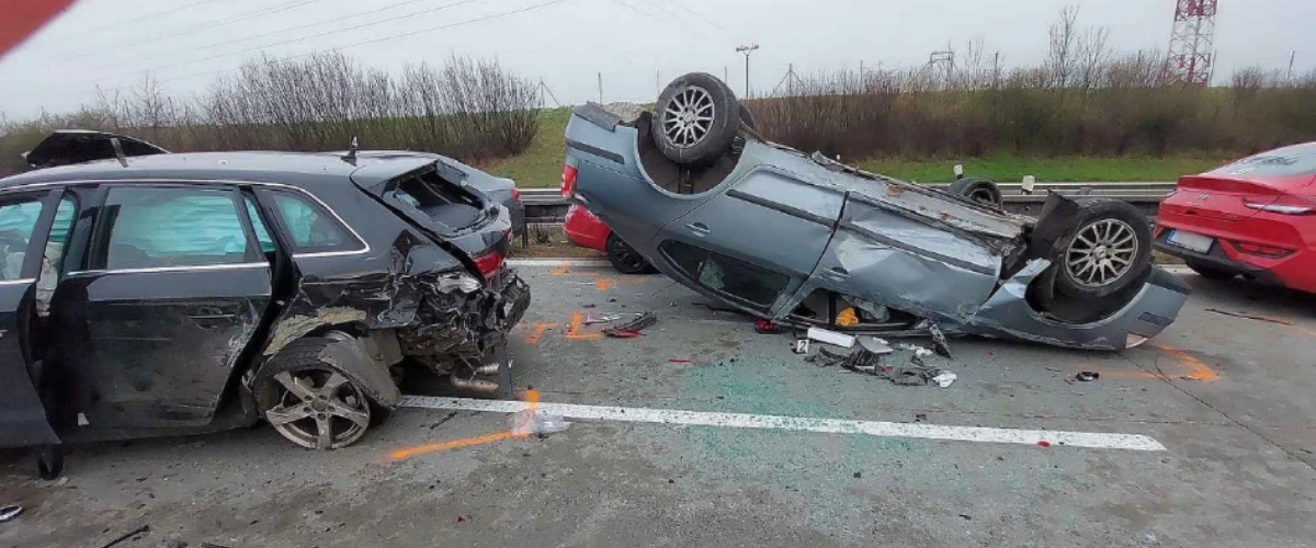 Picture showing a car crash with a car rolled over on to the roof.