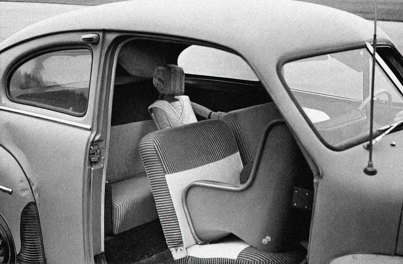 image of old car with old rear facing car seat