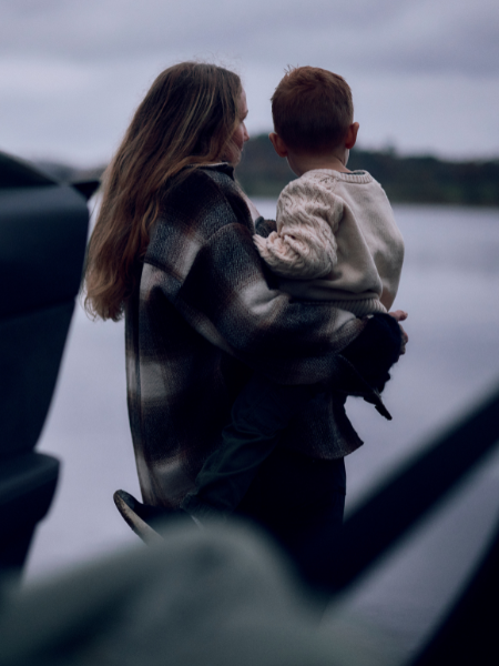 lifestyle image mother holding child mobile